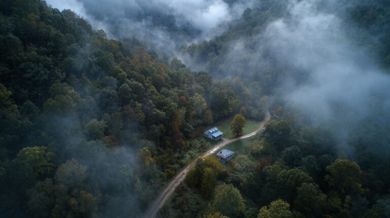 Aerial view of rural property in wooded hills, ideal for Kentucky Title Company, Real Estate Closing, Title Insurance, Lewis County, Wolfe County, Escrow Services, Residential Title Search.
